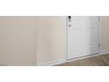 Home entryway featuring a white door, neutral wall paint, and wood-look flooring at 420 Ember St, Sanford, NC 27330