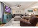 Cozy living room with a modern TV set, neutral walls, and comfortable seating at 5505 Knollwood Rd, Raleigh, NC 27609