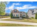 Charming two-story house with well-kept lawn, and inviting entrance at 615 Prides Crsg Xing, Rolesville, NC 27571
