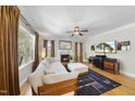 Comfortable living room featuring a fireplace, large windows, and modern decor at 629 Houndsditch Cir, Wake Forest, NC 27587