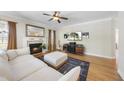 Spacious living room featuring a fireplace, media center, and comfortable seating at 629 Houndsditch Cir, Wake Forest, NC 27587
