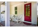 Inviting front porch with rocking chairs, perfect for relaxing and enjoying the neighborhood at 83 Vandalia Ave, Chapel Hill, NC 27516