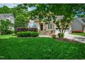 Inviting home with stone accents, manicured landscaping, a two-car garage, and a neatly kept lawn at 10113 San Remo Pl, Wake Forest, NC 27587