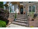 Inviting front entrance featuring stone steps and a charming front door at 10113 San Remo Pl, Wake Forest, NC 27587