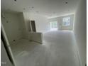 Spacious unfinished room with sliding glass doors, new white paint and multiple electrical connection points at 1029 Mountain Crown St, Durham, NC 27703