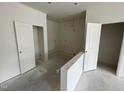 Unfinished room featuring new white paint, neutral flooring, white doors and multiple electrical connection points at 1029 Mountain Crown St, Durham, NC 27703