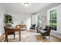 Bright office space featuring hardwood floors, shuttered windows, and neutral paint at 105 Bergeron Way, Cary, NC 27519