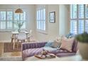 Bright living room featuring stylish furnishings, including a plush sofa and modern decor at 115 Standish Dr, Chapel Hill, NC 27517