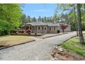 Beautifully landscaped home with a gravel driveway and a well-maintained lawn at 120 Wood Lake Dr, Fuquay Varina, NC 27526