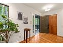 Bright foyer with hardwood floors, stylish decor, and access to the front porch and closet at 1213 Blackwood Mountain Rd, Chapel Hill, NC 27516