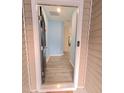 Entryway featuring pale blue walls, wood floors and view to other rooms at 1240 Grenshaw Dr, Morrisville, NC 27560