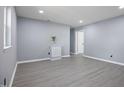 Bright living room with new gray flooring, fresh paint, and recessed lighting at 1317 Proctor St, Rocky Mount, NC 27801