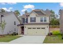 Beautiful two-story home featuring a spacious driveway and welcoming facade at 2007 Seford Dr, Durham, NC 27703