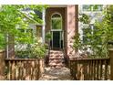 Inviting brick front entrance featuring an arched window and a well-maintained walkway at 205 Glenview Pl, Chapel Hill, NC 27514