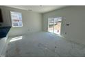 Bright dining area with sliding glass doors leading to the outdoors, adjacent to the kitchen at 2410 Abbot Hall Dr, Raleigh, NC 27616