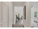 Bright, airy entry featuring vinyl floors and white walls that leads to the living area at 2611 Sawmill Rd, Raleigh, NC 27613