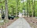 Private drive leads to home with attached garage, offering seclusion and parking convenience at 3648 Sleepy Hollow, Wake Forest, NC 27587