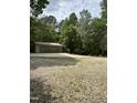 Spacious outbuilding with multiple garage doors providing ample storage and parking space at 5601 Plum Nearly Ct, Raleigh, NC 27610