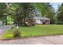 Charming single-story brick home with a well-maintained lawn and a mailbox at the curb at 5802 Newhall Rd, Durham, NC 27713