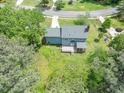 Aerial view of a two story home featuring a large deck, screened porch, and sprawling backyard at 7209 Halstead Ln, Raleigh, NC 27613