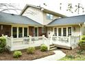 Spacious backyard deck, perfect for outdoor dining and entertaining with white railing at 775 Sid Eaves Rd, Youngsville, NC 27596