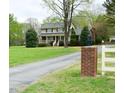 Traditional two-story home with a long driveway and mature landscaping, perfect for a serene setting at 775 Sid Eaves Rd, Youngsville, NC 27596