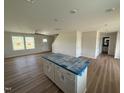 Open floor plan with a view of the stairs and an island with the sink at 10 Silver Ct, Smithfield, NC 27577