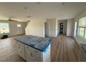 Spacious living area and kitchen with modern finishes and ample natural light at 10 Silver Ct, Smithfield, NC 27577