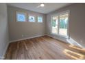 Bright bedroom with hardwood floors and multiple windows at 1005 Forrestal Pl, Durham, NC 27707