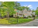 Beautiful two-story home on a corner lot, showcasing lush landscaping and a welcoming front porch at 101 Hay Sedge Ct, Durham, NC 27705