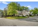 Inviting two-story home on a corner lot with a landscaped yard and a charming front porch at 101 Hay Sedge Ct, Durham, NC 27705
