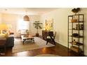 Spacious living room with hardwood floors, modern decor, and ample natural light at 112 E Edgewood Dr, Durham, NC 27704