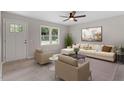 Bright living room with neutral decor, large windows, stylish furniture, and a ceiling fan at 1205 Freeman Dr, Sanford, NC 27330