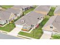 Aerial view of single-story homes in a neighborhood with manicured lawns and coordinated exteriors at 122 Tall Timber Dr, Gibsonville, NC 27249