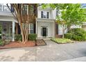 Charming townhome with brick accents, manicured landscaping, and a welcoming front entrance at 126 Star Thistle Ln, Cary, NC 27513
