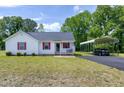 Traditional home with a carport, blacktop drive and well-manicured lawn at 141 Montesino Dr, Raleigh, NC 27603