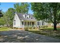 Beautiful two-story home featuring a well-manicured lawn, inviting porch and a paved driveway at 1429 Raybon Dr, Wendell, NC 27591
