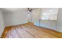 Spacious living room with wood-look floors, neutral walls and ceiling fan at 1622 Julian Oakley Rd, Rougemont, NC 27572