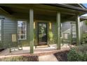 Inviting front porch with rocking chairs and stylish decor at 1820 Collier Rd, Durham, NC 27707