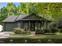 Charming home with a well-maintained front yard and beautiful landscaping at 1820 Collier Rd, Durham, NC 27707