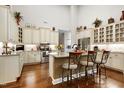 Bright kitchen featuring granite countertops, stainless steel appliances, a large island, and ample cabinet space at 199 Telluride Trl, Garner, NC 27529