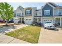 Street view of townhomes with well-manicured lawns and one-car garages at 225 Gulley Glen Dr, Garner, NC 27529