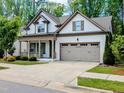Charming one-story home with a two-car garage and a welcoming front porch at 2472 Patriot Bluffs Dr, Fuquay Varina, NC 27526