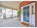 Welcoming front porch featuring a cozy swing, chairs, and a 'home sweet home' doormat at 2639 Oleander Dr, Durham, NC 27703