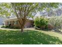 Well-maintained single-story brick home with lush green lawn and established landscaping, offering great curb appeal at 2715 Freemont Rd, Durham, NC 27705