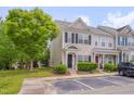 Attractive townhouse with a neat lawn, parking spaces, and landscaping features for curb appeal at 3114 Courtney Creek Blvd, Durham, NC 27713
