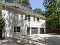 Spacious three-car garage with a modern design and a convenient side entrance at 3332 Langston Cir, Apex, NC 27539