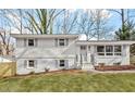 Charming two-story home with landscaped yard and freshly painted white brick at 3408 Brentwood Rd, Raleigh, NC 27604