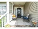 Inviting front porch with stone floor, seating, and stylish decor for a welcoming entrance to the home at 503 Bellefont Ct, Knightdale, NC 27545