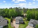 Aerial view of a well-maintained home with a lush green lawn in a quiet neighborhood at 503 Mugo Pine Ct, Wendell, NC 27591